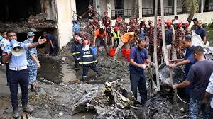 Rescue workers and local residents search through the rubble of Shonar Bangla Model School after a Bangladesh Air Force jet crashed into the building in Chattogram.