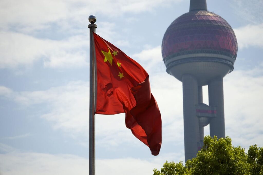 Chinese flags flutter near the Ministry of Commerce in Beijing as China accelerates implementation of the U.S. trade deal framework.