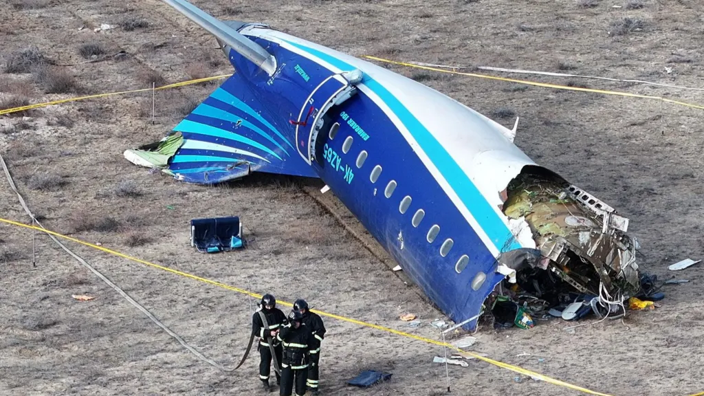 Rescue workers survey the wreckage after a tragic plane crash in Russia that claimed dozens of lives.