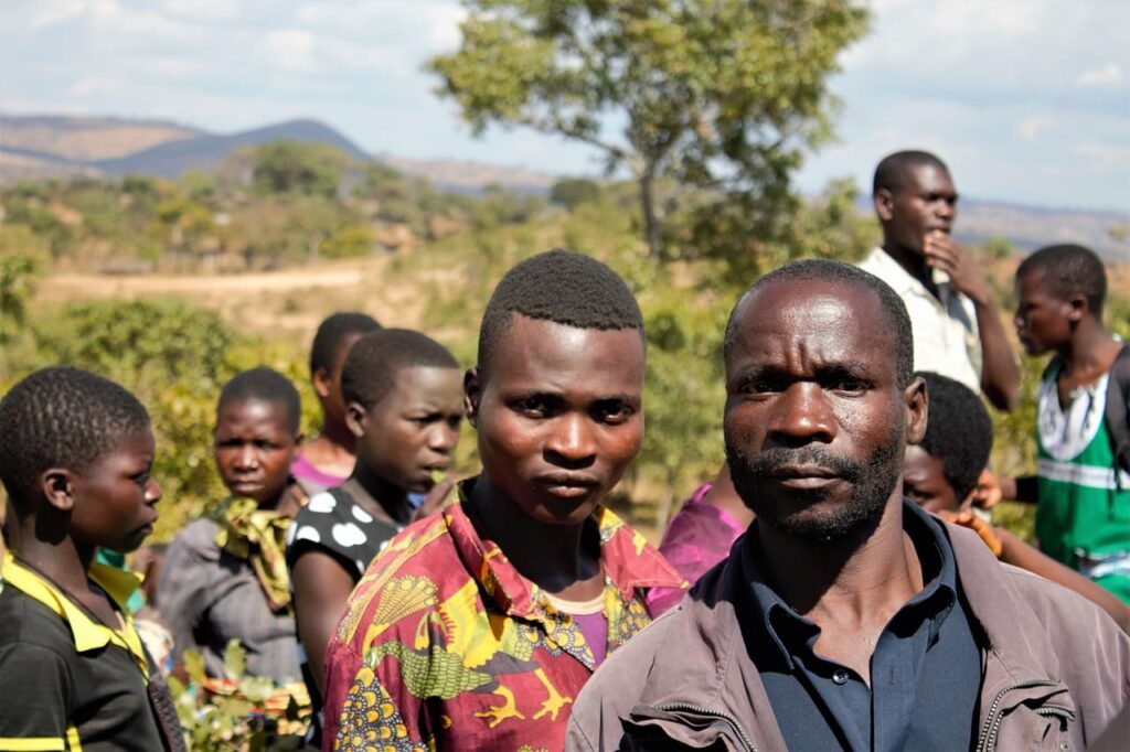South Sudanese people gathered together, reflecting resilience and community spirit in a region shaped by conflict and hope.