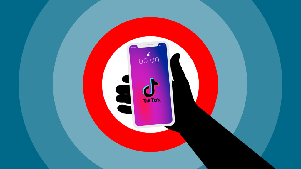 person-holding-phone-opening-tiktok A person holding a smartphone and opening the TikTok app on the screen.