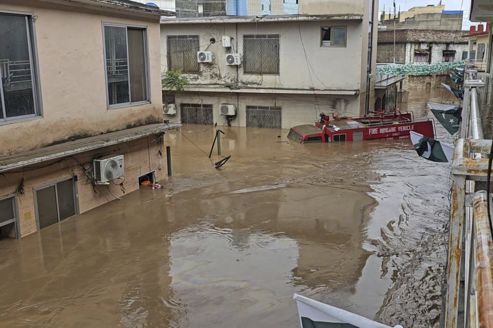 Rescue workers evacuate stranded residents after flash floods triggered by heavy monsoon rains in northern Pakistan.