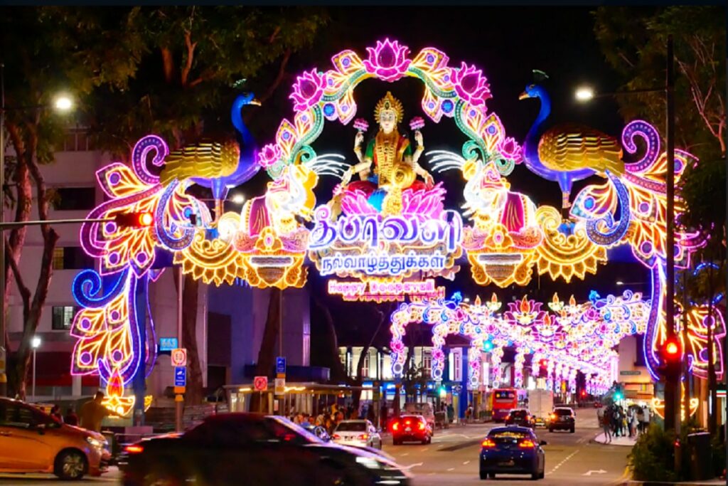 Colorful Deepavali celebrations in Singapore’s Little India with streets decorated with lights and people enjoying the festival.
