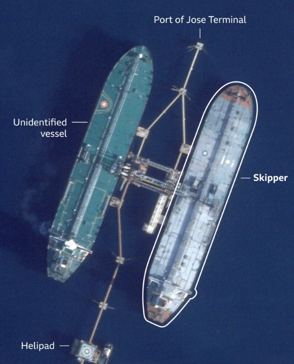 A U.S. Coast Guard vessel approaches a Venezuelan oil tanker during a high-tension maritime seizure operation.