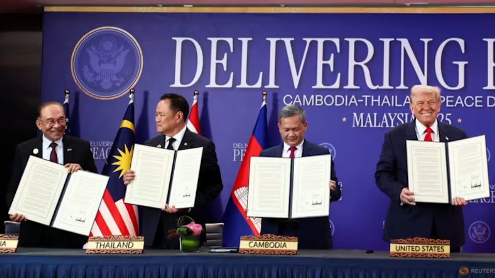 Leaders of Thailand, Cambodia, and the United States hold signed documents during a diplomatic event aimed at renewing a ceasefire.