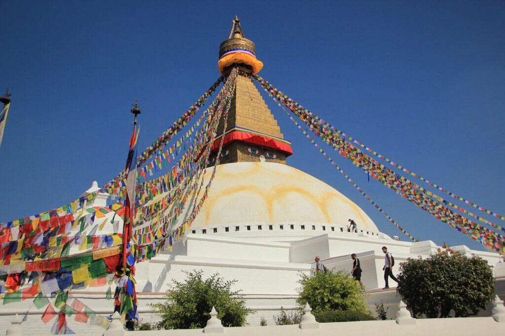 Peaceful morning at Boudhanath Stupa as monks and devotees walk around the sacred site